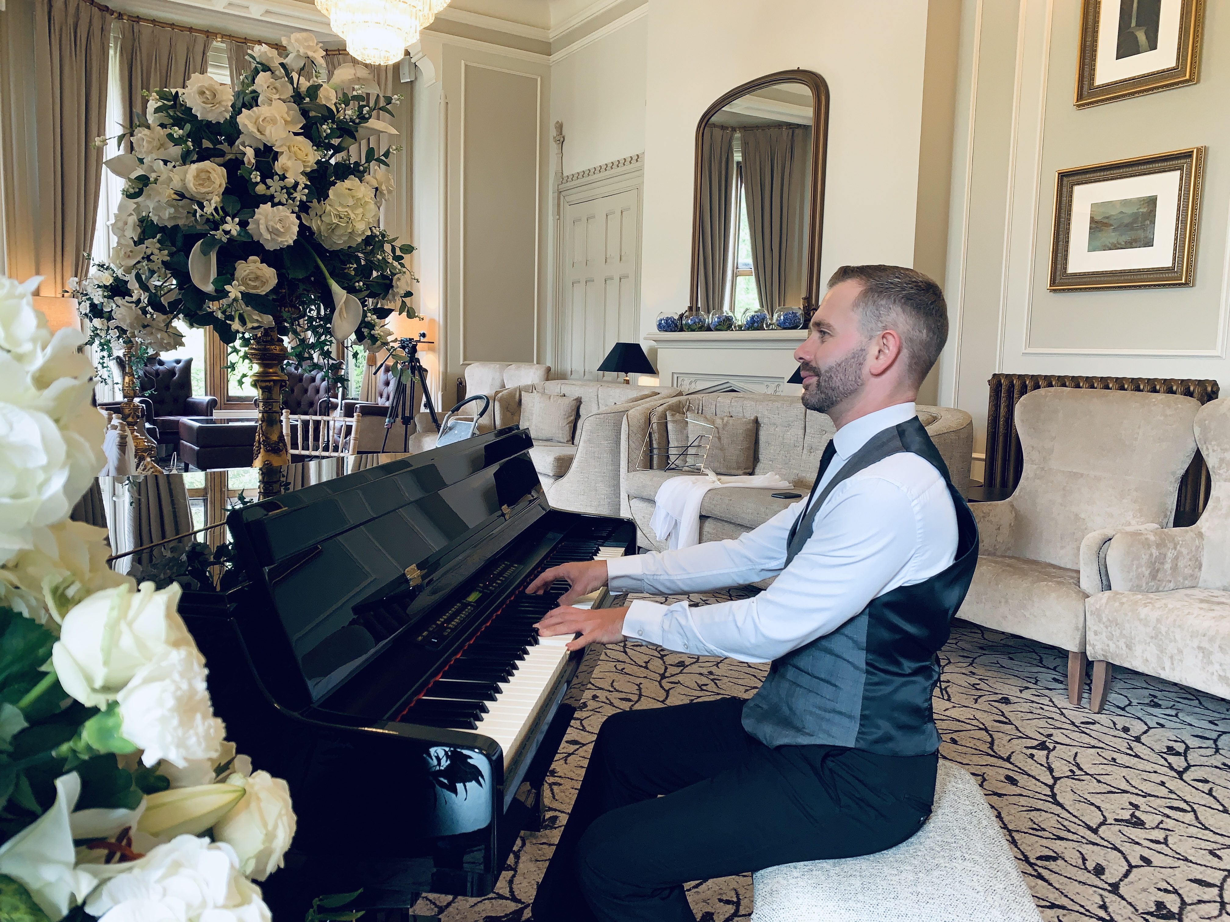 Armathwaite Hall pianist Craig Smith playing piano during a wedding ceremony