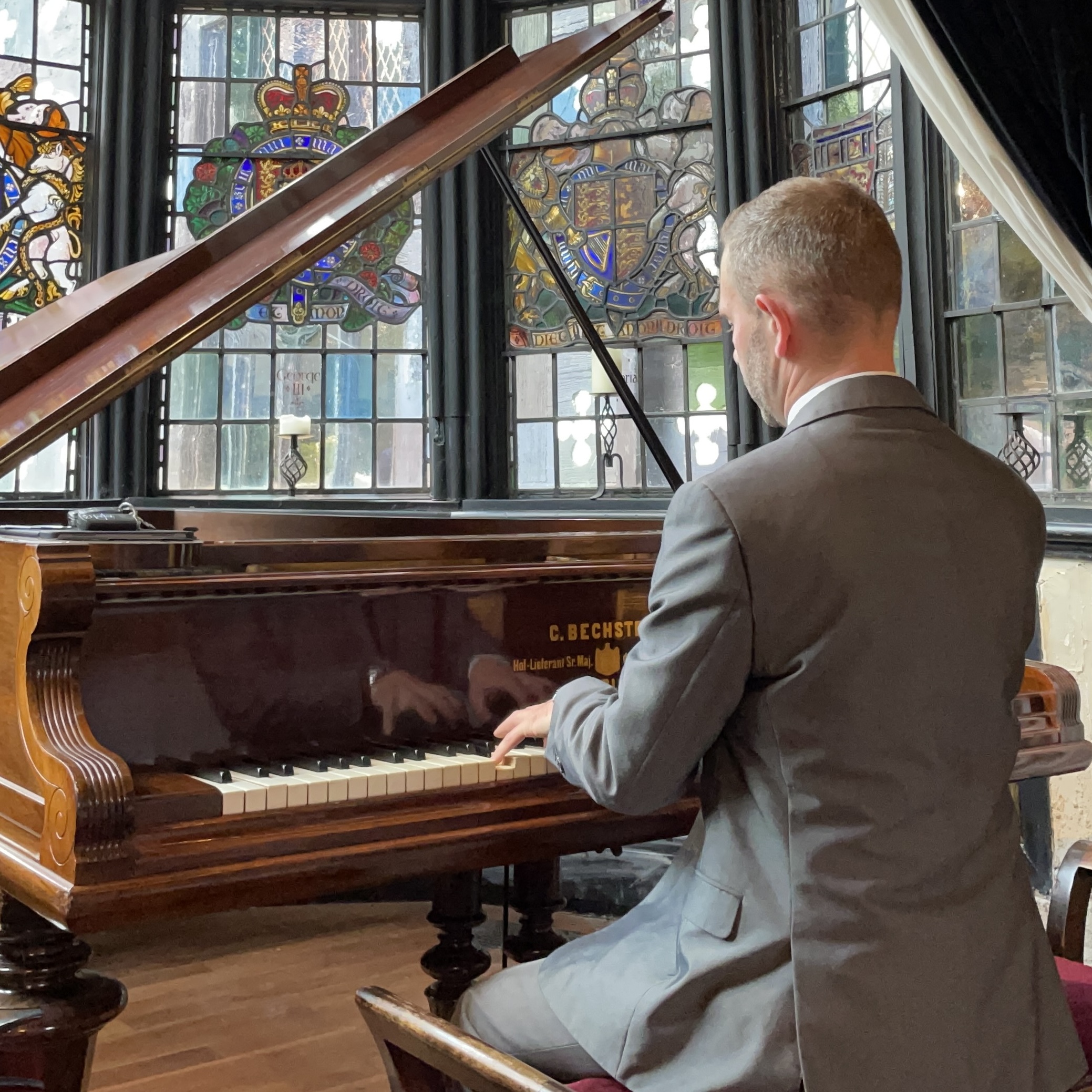 Wedding pianist Craig Smith performs during a Samlesbury Hall wedding ceremony in the Great Hall