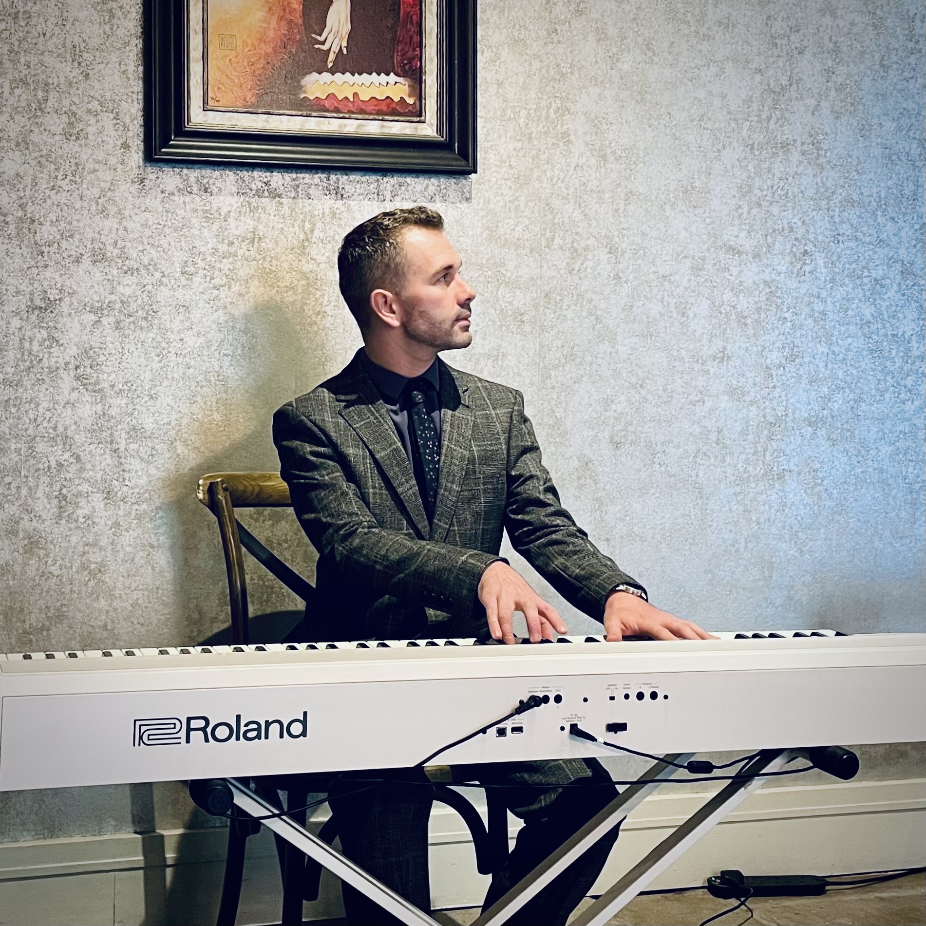 West Tower pianist Craig Smith plays during a wedding reception in the Cellar Bar